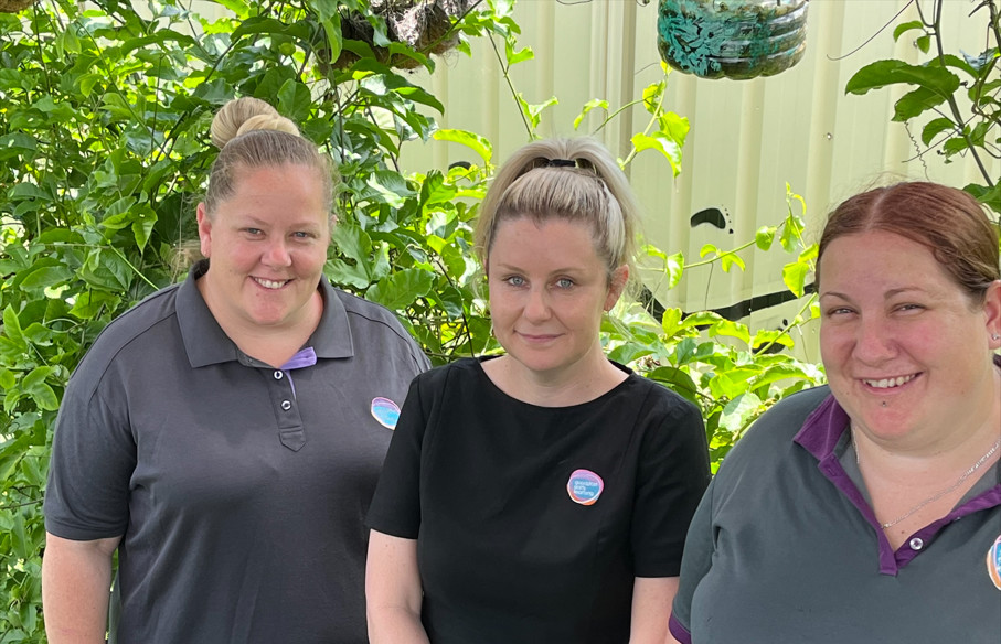 Centre Director Megan Fisher, centre, pictured with two Educators who have been working at Goodstart Petrie for 20 years.