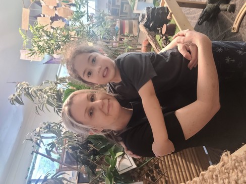 Megan pictured with a child at the centre.